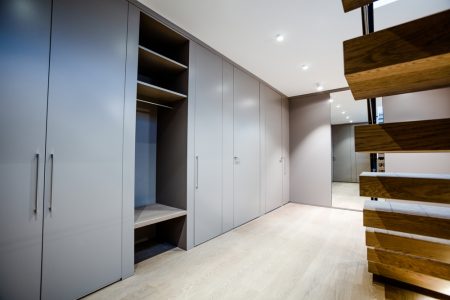 Grey hinged door wardrobe, a creation of luxury bespoke furniture design